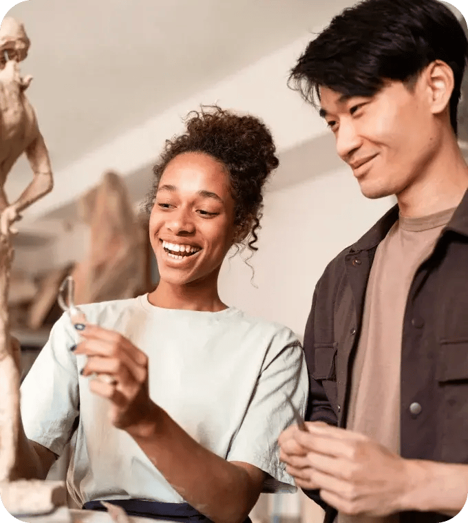 Friends looking at a sculpture