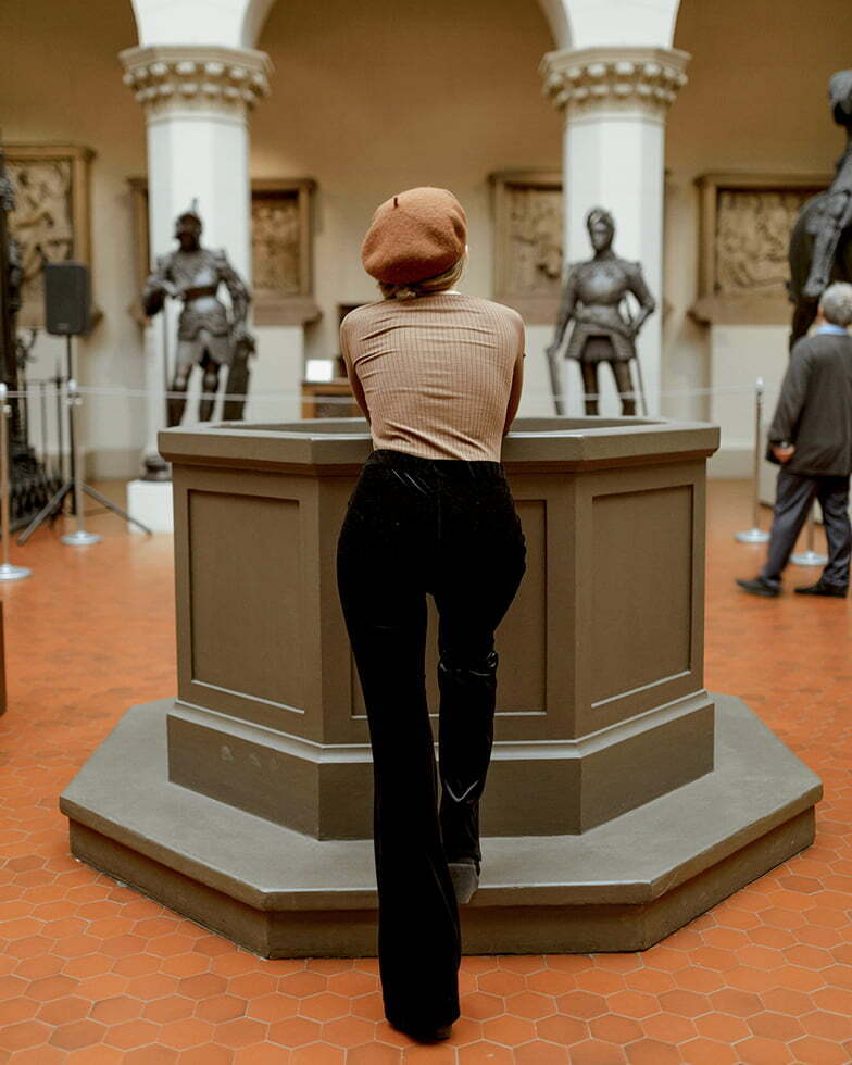 Museum visitor engaging with exhibits inside a gallery