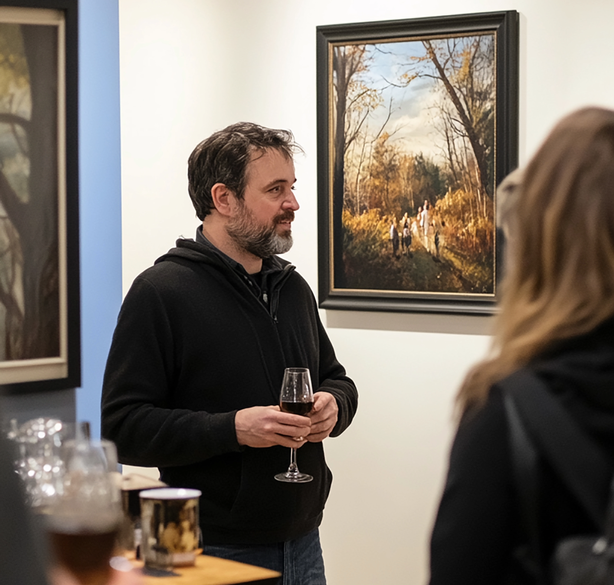 Man at an art opening in a gallery