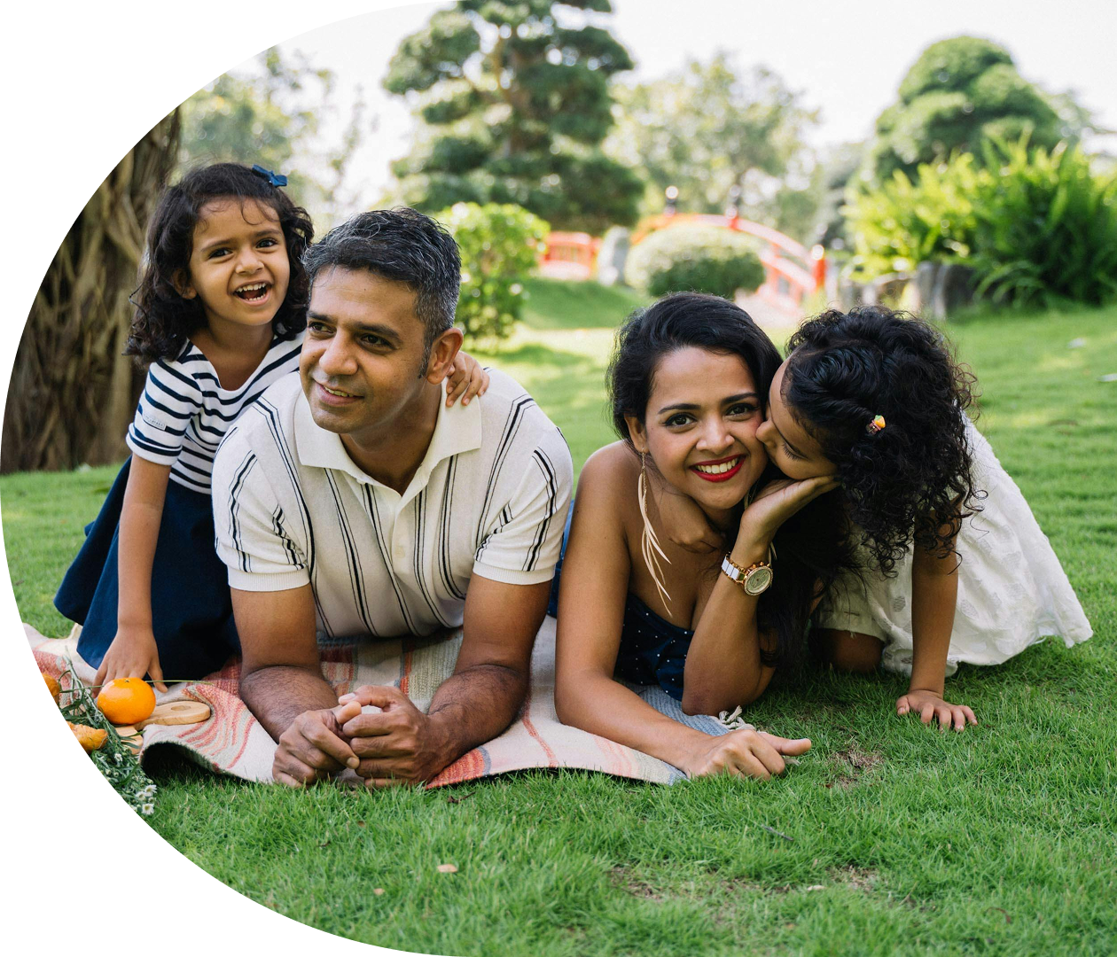 Family enjoying botanical garden lawn