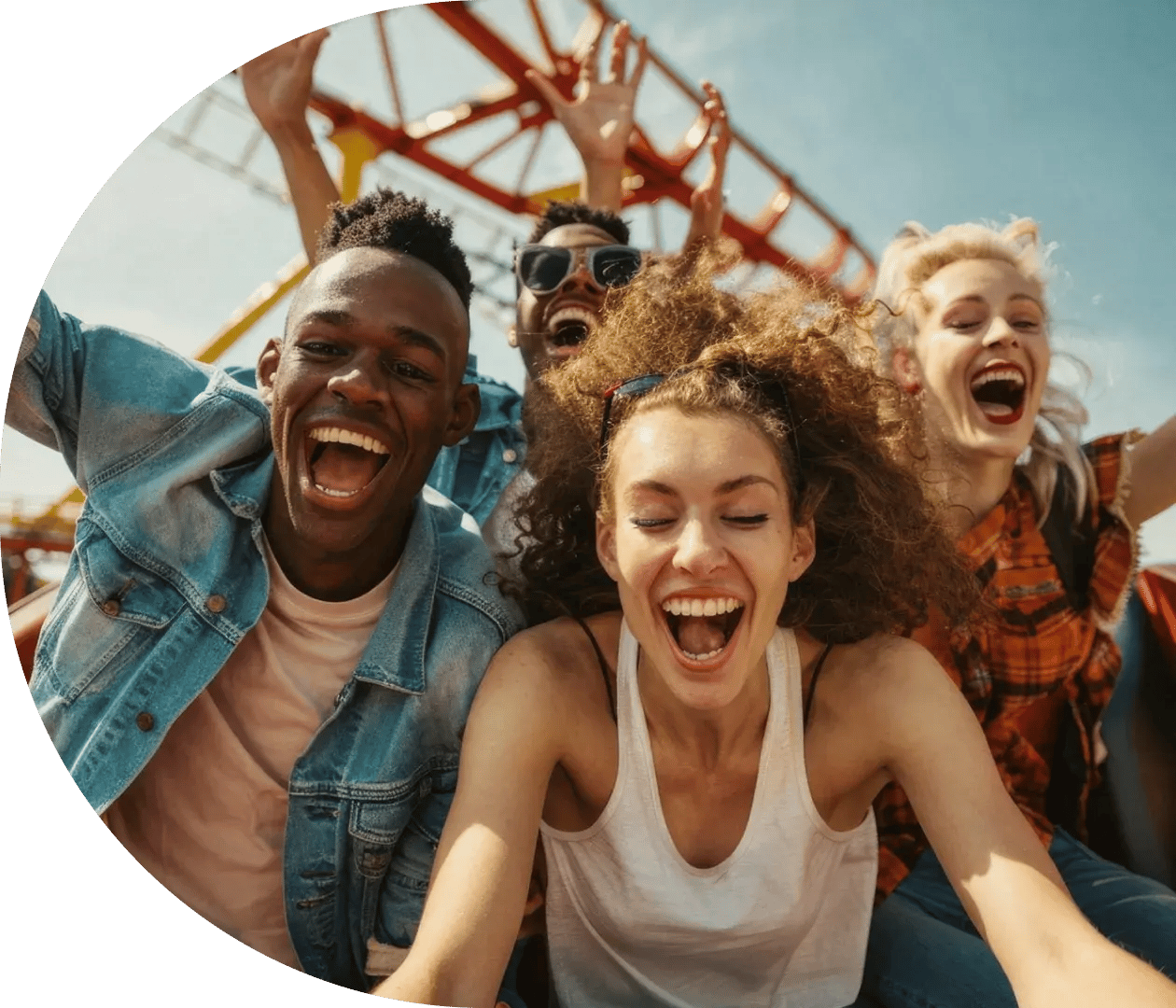 Friends ride a roller coaster at a visitor attraction